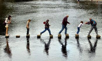 Bodies in Motion on Stepping Stones at Bolton Abbey (Skipton, North Yorkshire, UK: September 2007 )